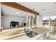 Bright kitchen area featuring a sink overlooking a large island and a cozy living room area at 4899 S Dudley St # 3, Littleton, CO 80123