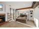 Inviting living room features a cozy fireplace, stylish furniture, and seamless access to the outdoors at 4899 S Dudley St # 3, Littleton, CO 80123