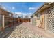 Fenced yard with two rockscapes and a wooden privacy fence in the background at 396 Tucson St, Aurora, CO 80011