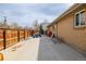 Wide backyard and outdoor storage area with wooden fence around the border for privacy at 396 Tucson St, Aurora, CO 80011