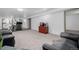 Large finished basement with new carpet and ample space for fitness equipment and a TV area at 396 Tucson St, Aurora, CO 80011