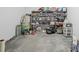 Unfinished basement area with ample storage shelves and concrete floor at 396 Tucson St, Aurora, CO 80011