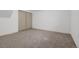Finished bedroom in the basement with carpeted floor and a large closet at 396 Tucson St, Aurora, CO 80011
