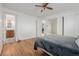 Bedroom with hardwood floors, and views of the bathroom and closet at 396 Tucson St, Aurora, CO 80011