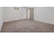 Finished bedroom in the basement featuring carpeted floors, natural light, and closet at 396 Tucson St, Aurora, CO 80011