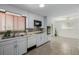 Kitchen featuring modern appliances, white cabinets, and an open-concept layout at 396 Tucson St, Aurora, CO 80011
