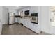 Updated kitchen featuring stainless steel appliances and ample cabinet space at 396 Tucson St, Aurora, CO 80011