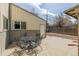 Backyard patio featuring four chairs and a table at 396 Tucson St, Aurora, CO 80011