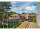 Outdoor deck area overlooking green space and neighboring buildings, perfect for enjoying the outdoors at 13782 E Lehigh Ave # H, Aurora, CO 80014