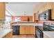 Contemporary kitchen with modern appliances and great view of the living room with fireplace at 13782 E Lehigh Ave # H, Aurora, CO 80014
