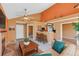 Inviting living room with vaulted ceilings, stylish decor, and seamless flow to the kitchen at 13782 E Lehigh Ave # H, Aurora, CO 80014