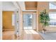 Bright living room showcasing a sliding glass door, big windows, and great flooring at 13782 E Lehigh Ave # H, Aurora, CO 80014