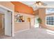 Open-concept living area with breakfast bar, fireplace, and access to the backyard at 13782 E Lehigh Ave # H, Aurora, CO 80014