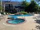 Community pool area featuring multiple pools, hot tub, lounge chairs and well-maintained landscaping at 13782 E Lehigh Ave # H, Aurora, CO 80014