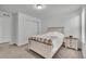 A comfortable bedroom featuring neutral colors, soft carpeting, and ample closet space at 6591 N Ceylon St, Denver, CO 80249