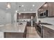 Modern kitchen featuring stainless steel appliances, a large island, and ample cabinet space for storage at 6591 N Ceylon St, Denver, CO 80249