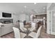 Combined dining, living and kitchen area with an open floor plan at 6591 N Ceylon St, Denver, CO 80249
