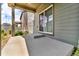 Covered patio includes a sliding door entrance, enhancing outdoor living and entertaining space at 6591 N Ceylon St, Denver, CO 80249