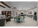 Spacious basement with a recreation area and dining space, perfect for entertaining at 7912 Raphael Ln, Littleton, CO 80125