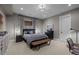 Cozy bedroom featuring a comfortable bed, soft lighting, and carpeted flooring at 7912 Raphael Ln, Littleton, CO 80125