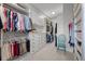 Walk-in closet with custom shelving and drawers, perfect for organization at 7912 Raphael Ln, Littleton, CO 80125