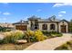 Beautiful two-story home with stone accents, mature landscaping, and a welcoming walkway at 7912 Raphael Ln, Littleton, CO 80125