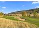 Golf course view showing sand trap and hills at 7912 Raphael Ln, Littleton, CO 80125