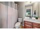 Clean bathroom with a shower/tub combo and updated vanity at 5562 Rim View Pl, Parker, CO 80134