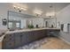 Bathroom featuring a large vanity with dual sinks, neutral tiling, and a seating area at 5562 Rim View Pl, Parker, CO 80134