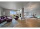 This spacious living room features wood floors, a modern fireplace, and great natural light at 5562 Rim View Pl, Parker, CO 80134