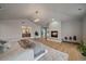 The well-lit main bedroom showcases a fireplace, hardwood floors, and views of the bathroom at 5562 Rim View Pl, Parker, CO 80134