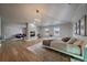 Bright main bedroom features a modern fireplace, two windows, and spacious seating area at 5562 Rim View Pl, Parker, CO 80134