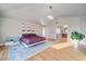 Spacious main bedroom with hardwood floors and ensuite bathroom at 5562 Rim View Pl, Parker, CO 80134