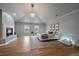 Large main bedroom features hardwood floors, a modern fireplace, and recessed lighting at 5562 Rim View Pl, Parker, CO 80134