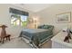 Bedroom featuring a window with curtains, natural light, and neutral colored walls at 10064 Bluffmont Ct, Lone Tree, CO 80124
