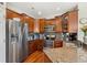 Well-equipped kitchen with stainless steel appliances, granite countertops, and wood cabinetry, ready for culinary adventures at 10064 Bluffmont Ct, Lone Tree, CO 80124