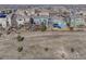 View of suburban homes backing to a natural area with walking path at 15972 E Tall Timber Ln, Parker, CO 80134