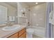 Cozy bathroom featuring a single sink, tiled floor, and combined shower and tub at 15972 E Tall Timber Ln, Parker, CO 80134