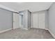 Basement bedroom featuring carpeting, base-trim, and closet space at 15972 E Tall Timber Ln, Parker, CO 80134