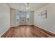 Bedroom with hardwood floors, a window seat, and natural light at 15972 E Tall Timber Ln, Parker, CO 80134