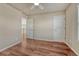 Bedroom featuring hardwood floors, two doorways, and natural light at 15972 E Tall Timber Ln, Parker, CO 80134