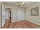 Bedroom featuring hardwood floors, a closet, and a white-trimmed door at 15972 E Tall Timber Ln, Parker, CO 80134