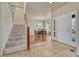 Bright foyer with tile floors, staircase and dining room at 15972 E Tall Timber Ln, Parker, CO 80134