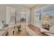 Open-concept living room with a view of the stairs and dining area at 15972 E Tall Timber Ln, Parker, CO 80134