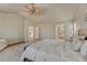 Bright vaulted main bedroom with a ceiling fan and ensuite bathroom at 15972 E Tall Timber Ln, Parker, CO 80134