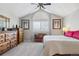 Vaulted ceiling bedroom with bright window, wood furnishings, and neutral carpet at 4976 S Nelson St # A, Littleton, CO 80127