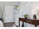 Entryway with wood floors, a staircase, console table, and a view outside at 4976 S Nelson St # A, Littleton, CO 80127