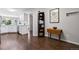 Hallway featuring white cabinets, hardwood floors and natural light at 4976 S Nelson St # A, Littleton, CO 80127