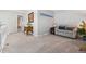 Cozy loft area with comfortable seating, a decorative plant, and neutral carpet at 4976 S Nelson St # A, Littleton, CO 80127