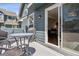 Outdoor patio featuring a table and chairs, a grill, and access to the interior at 4976 S Nelson St # A, Littleton, CO 80127